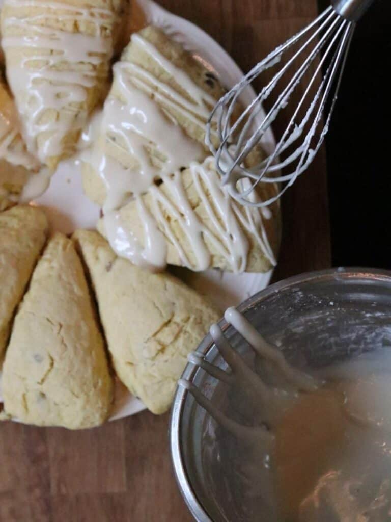 drizzling glaze on redbud scones