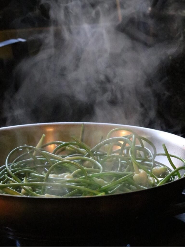 steaming sautéed garlic scapes