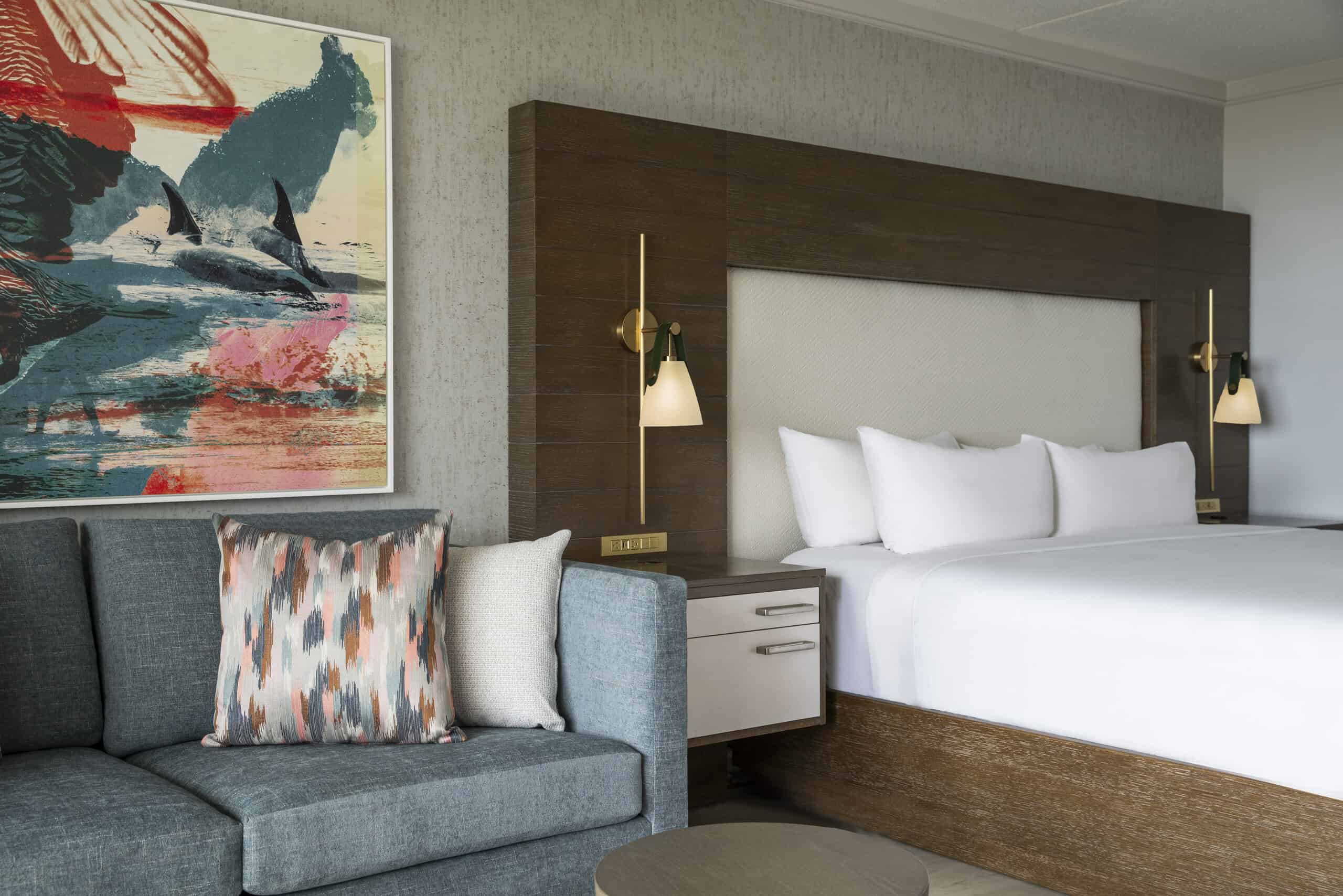 Hotel room with a bed and a seating area.