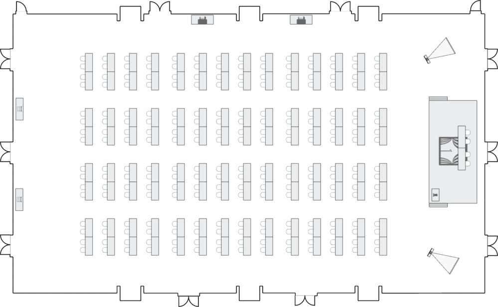 Ballroom with long tables and stage area.