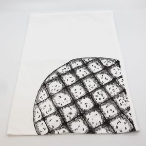 vzorec belokranjske pogače na kuhinjski krpi