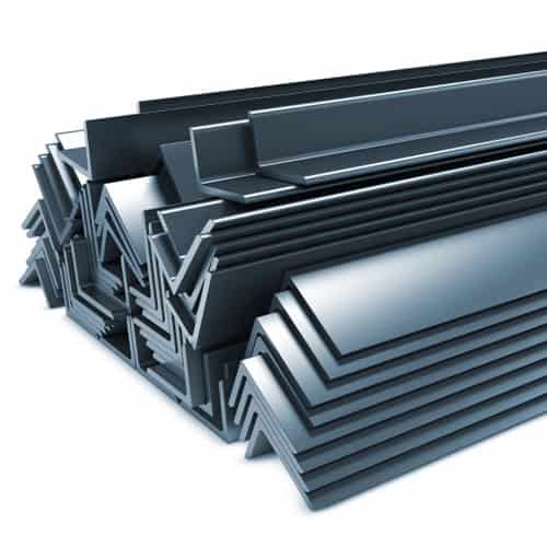 Steel sections stacked for construction, showcasing structural steel profiles.