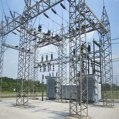 Transmission tower with electrical insulators and transformers.