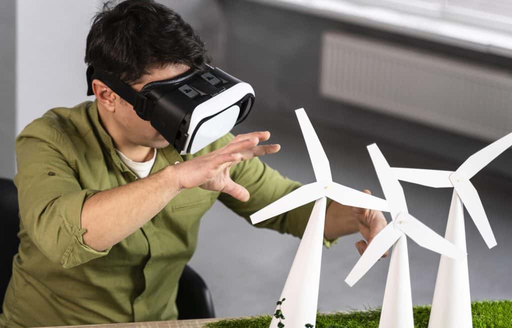 man working eco friendly wind power project using virtual reality headset