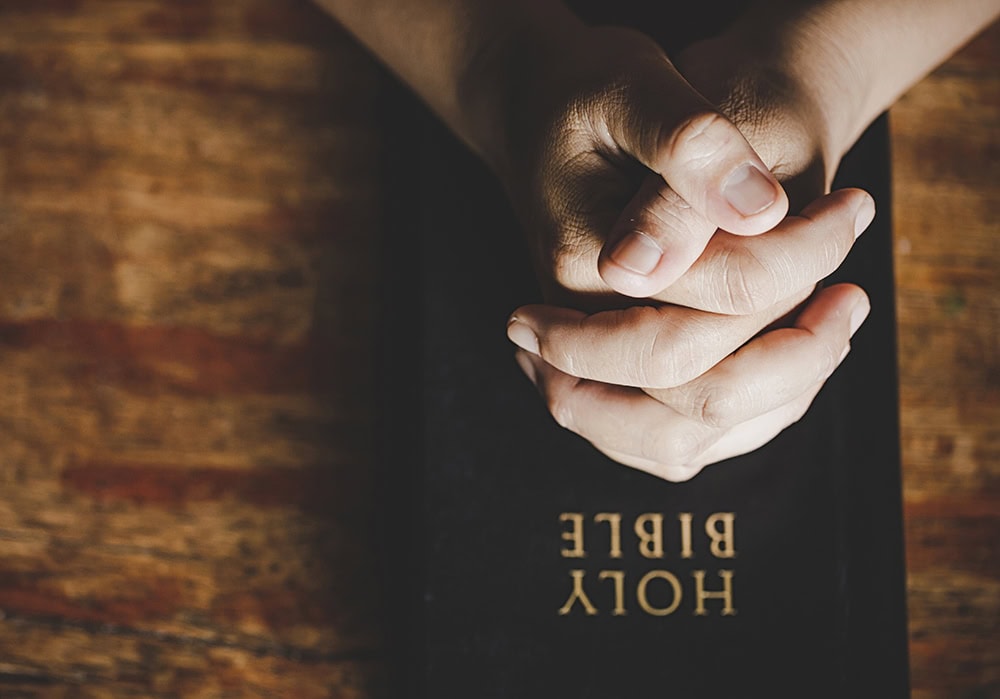 Hope Again Wellness Center, caring hands in prayer for mental health and spiritual healing, promoting hope and recovery.