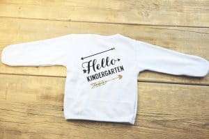 White children's T-shirt with "Hello Kindergarten" design for back-to-school.