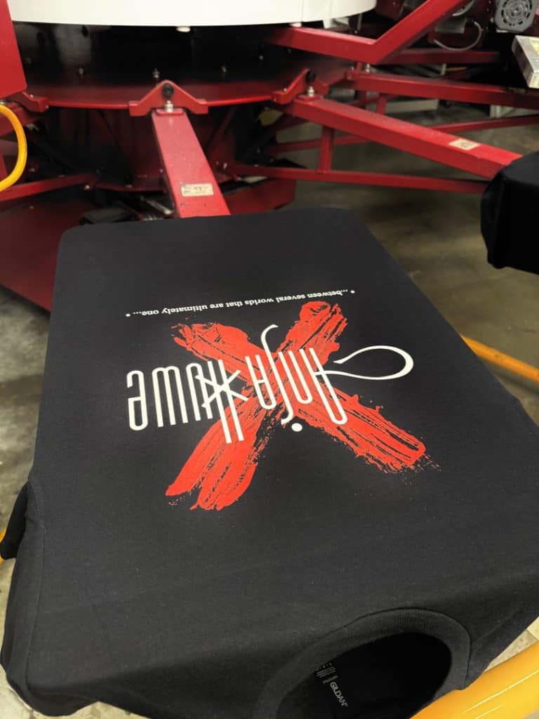 Custom black T-shirt with a red and white screen printing