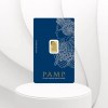 blue cased pamp1g gold bar set against white curtain backdrop
