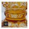close up pedestal detail on amber vase cut to clear crystal vase