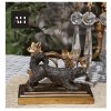 Detailed view of the dark patinated spaniel base on Antique Gilt Spaniel Candelabra showing crisp Victorian casting