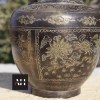Close up of dragon engraving on Chinese Brass Dragon Vase showing texture and aged surface