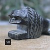 Carved cavity of antique stone lion pyrogene designed to hold a small matchbox