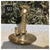 Side profile of Victorian Brass Chamberstick showing wide stable base and curved handle