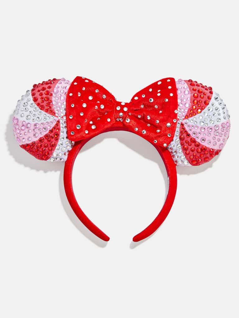 Sparkly Minnie Mouse ears headband with red bow and colorful polka dot pattern, perfect Disney fashion accessory for kids and adults.