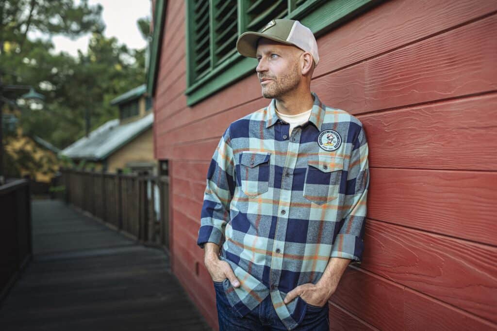 Vintage plaid flannel shirt with Disney patch, casual men's fashion, outdoor wear, stylish and comfortable.