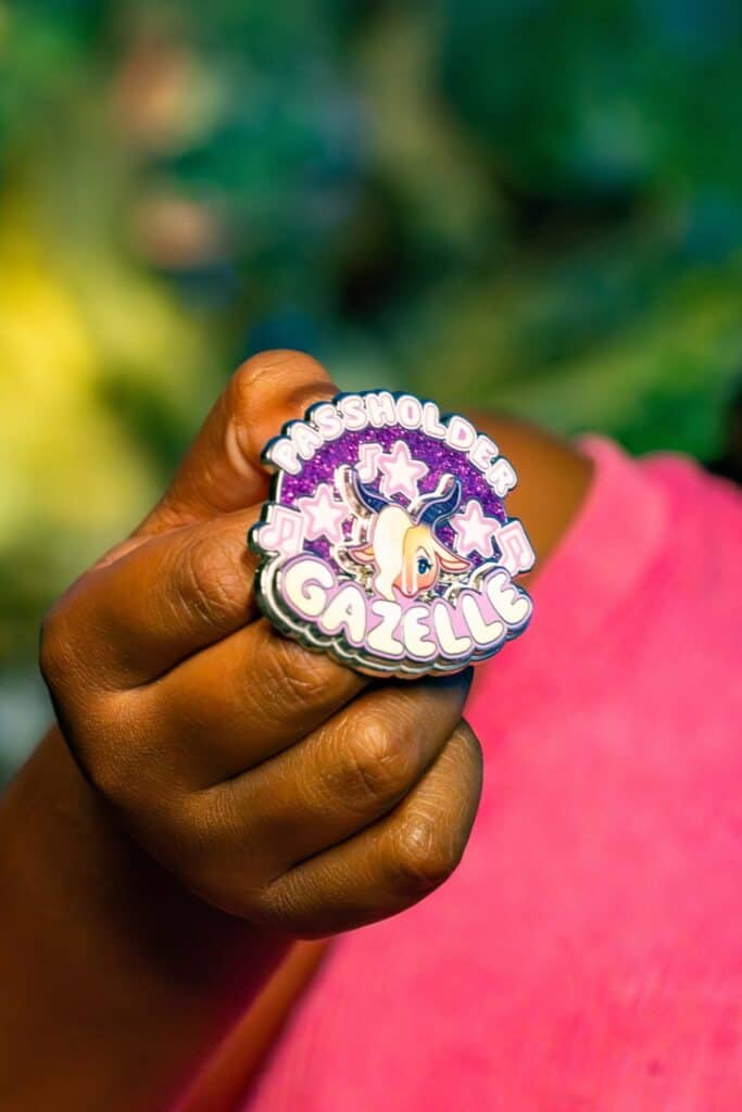 Passholder Gabby Disney pins with unicorn and star design, vibrant purple glitter background, collectible Disney accessory.