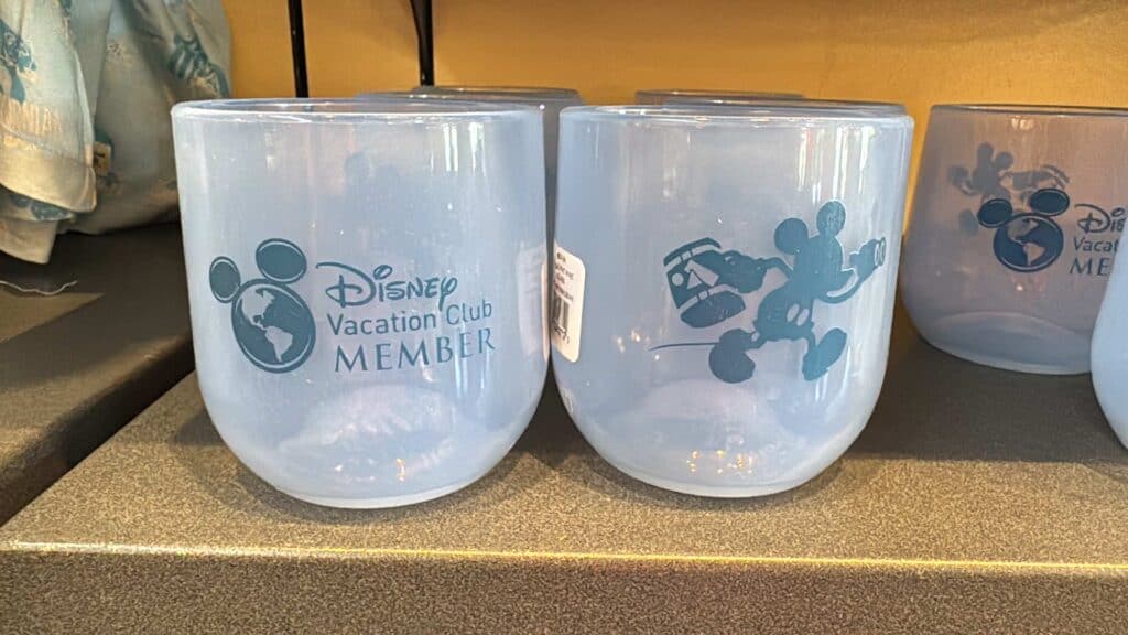 Disney Vacation Club member Mickey Mouse and globe logo souvenir cups.