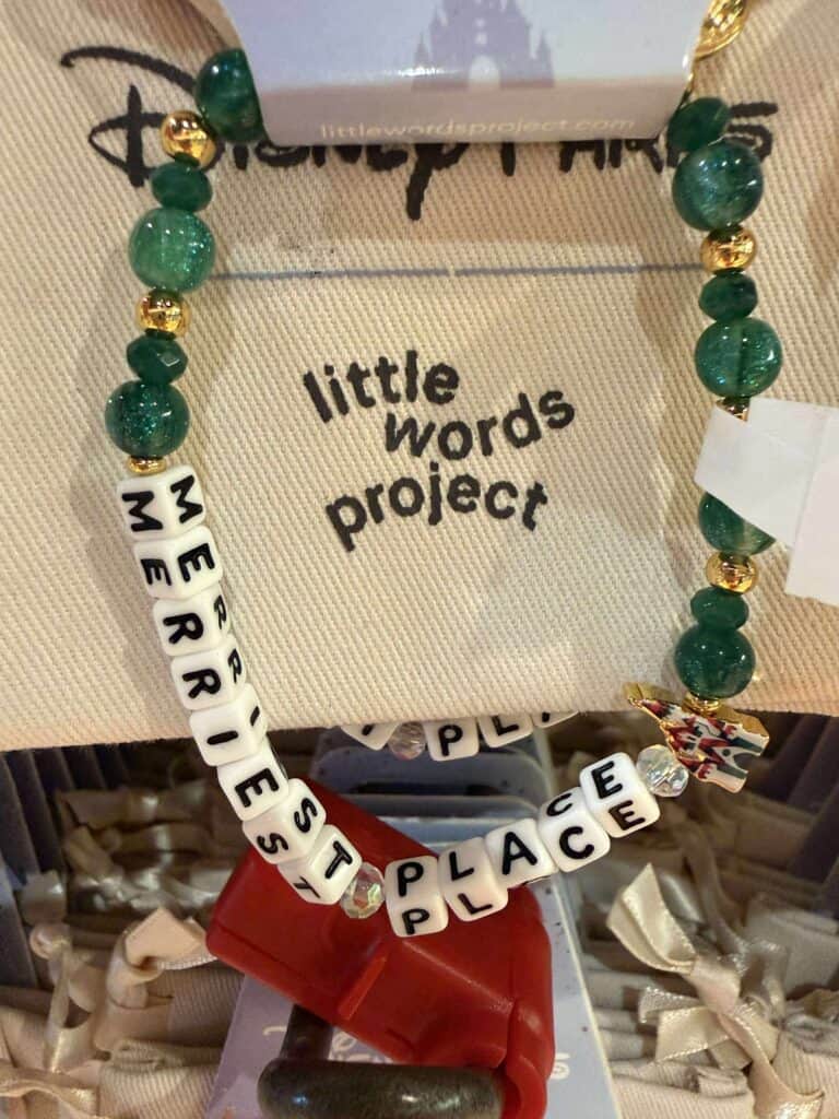 Colorful beaded Disney-inspired jewelry necklace with personalized letter beads and charms.