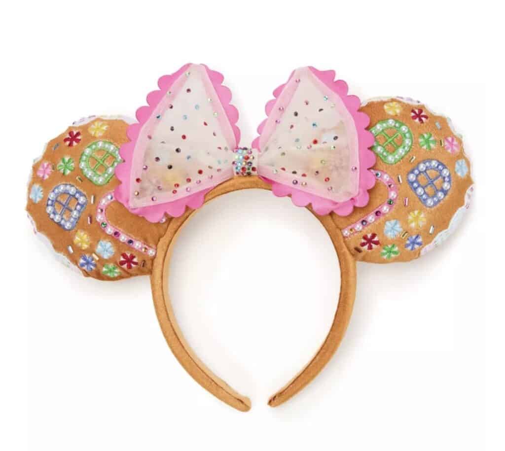 Colorful Disney Minnie Mouse ears headband with embellished bow and candy-themed decorations for Disney fashion fans.
