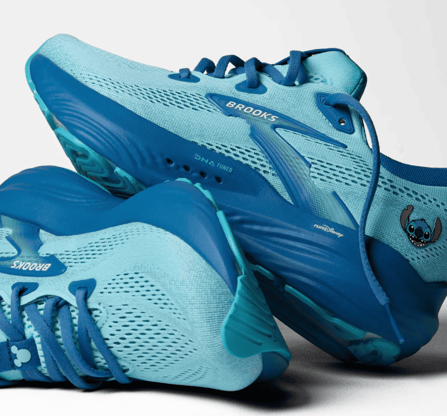 Bright blue Brooks running shoes inspired by Disney's Stitch, featuring a Stitch decal and breathable mesh design.