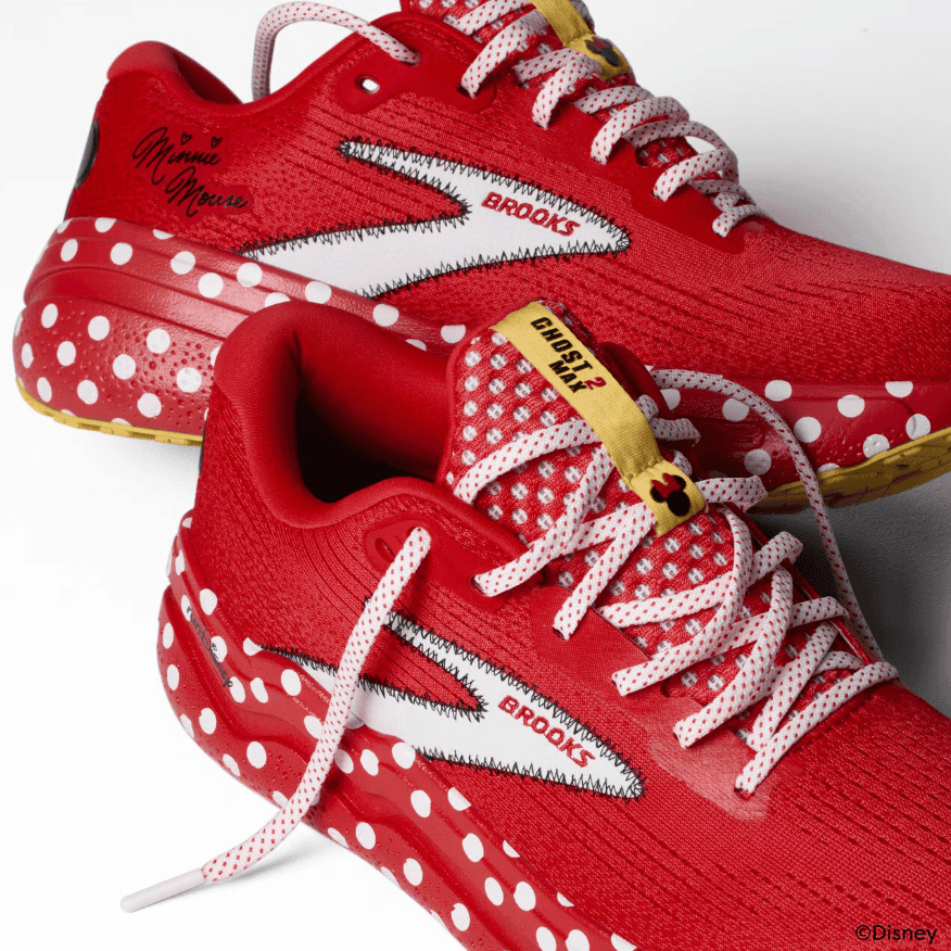 Red Disney Mickey Mouse-themed athletic sneakers featuring polka dots and iconic character details.