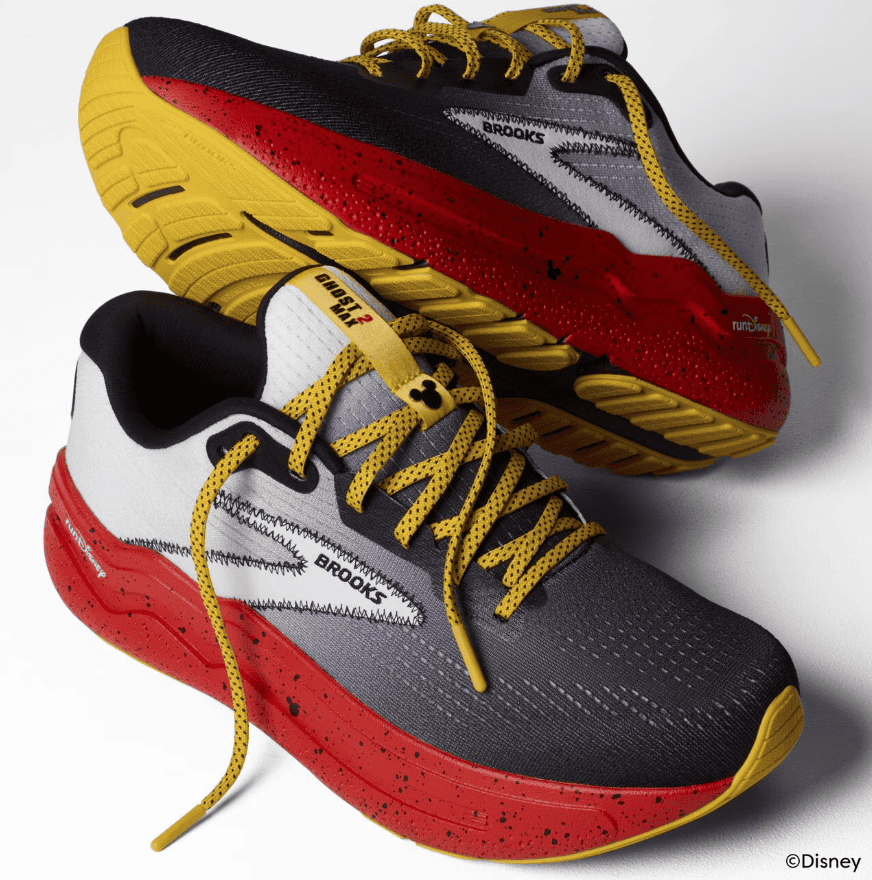 Vibrant Disney x Brooks running shoes with bold red, yellow, and gray design, perfect for Disney fans and athletes.