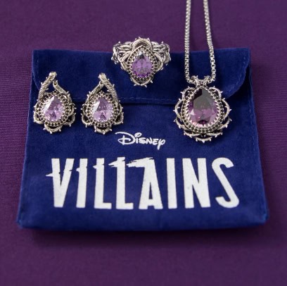 Sparkling purple villain jewelry set with earrings, necklace, and ring on Disney Villains velvet pouch.