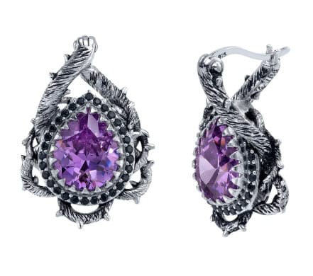 Intricate silver earrings with purple gemstones, inspired by Disney fashion accessories.