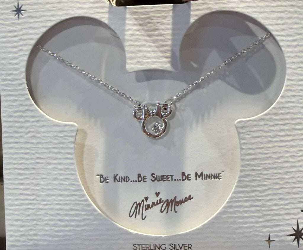 Delicate Minnie Mouse necklace with sterling silver finish and cubic zirconia charm, perfect Disney fashion jewelry.