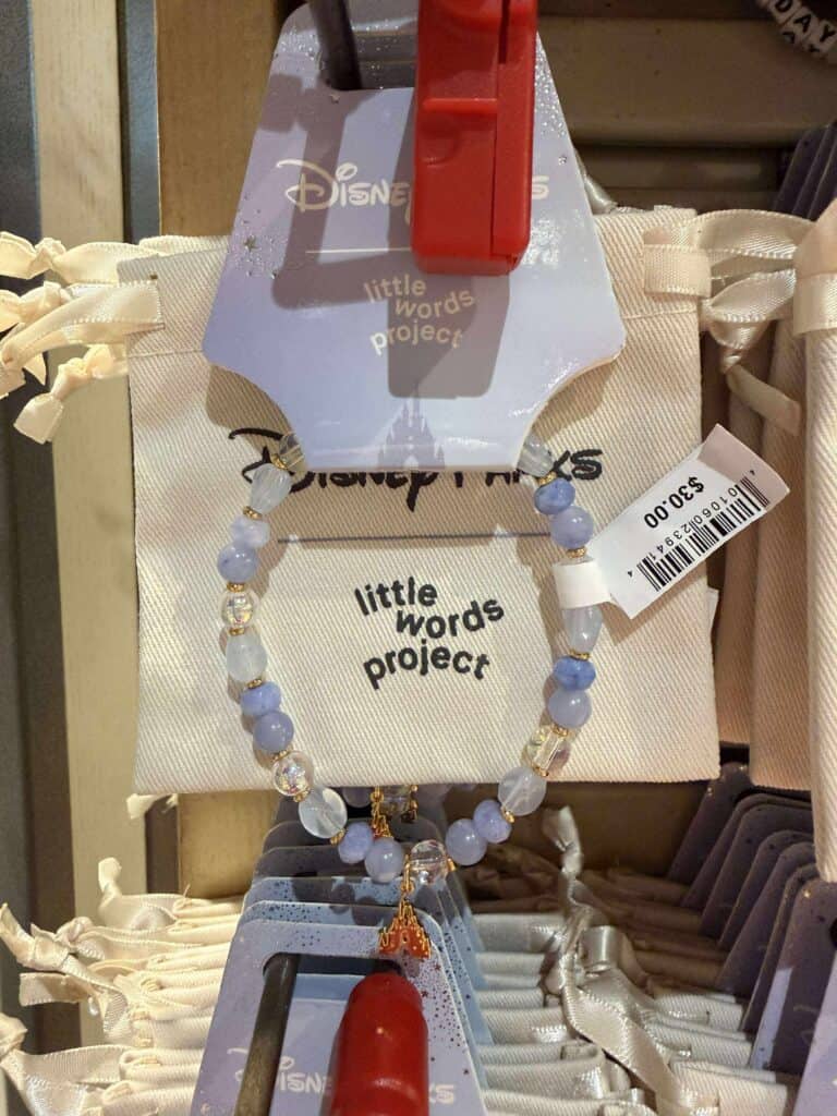 Blue and white beaded Disney-inspired necklace with a charm, part of Little Words Project Disney collection, perfect for Disney fashion accessories.