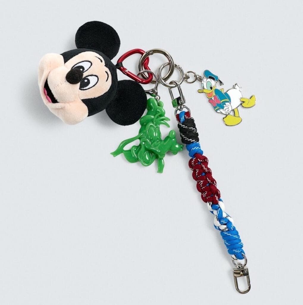 Mickey Mouse plush keychain with colorful rope lanyard and Disney character charms.