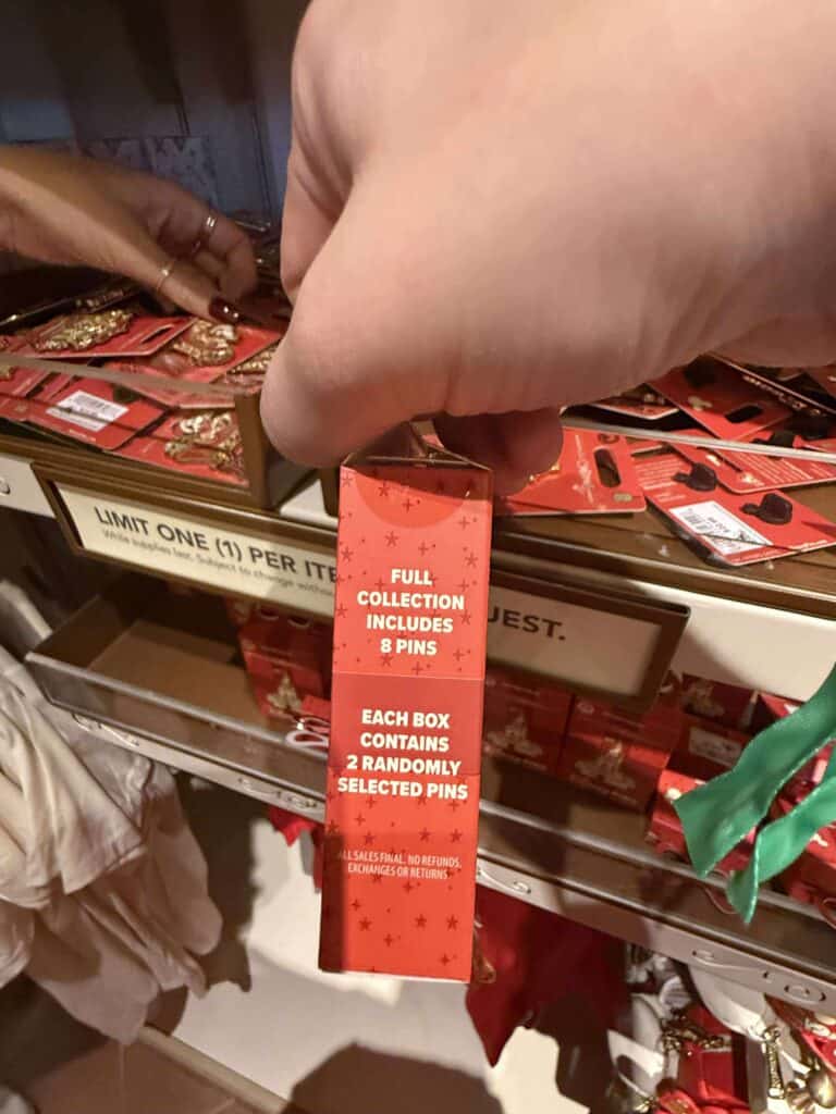 Pin collection gift box details, Disney-themed holiday pins, limited-edition Disney jewelry, Christmas accessories, Disney merchandise for collectors.