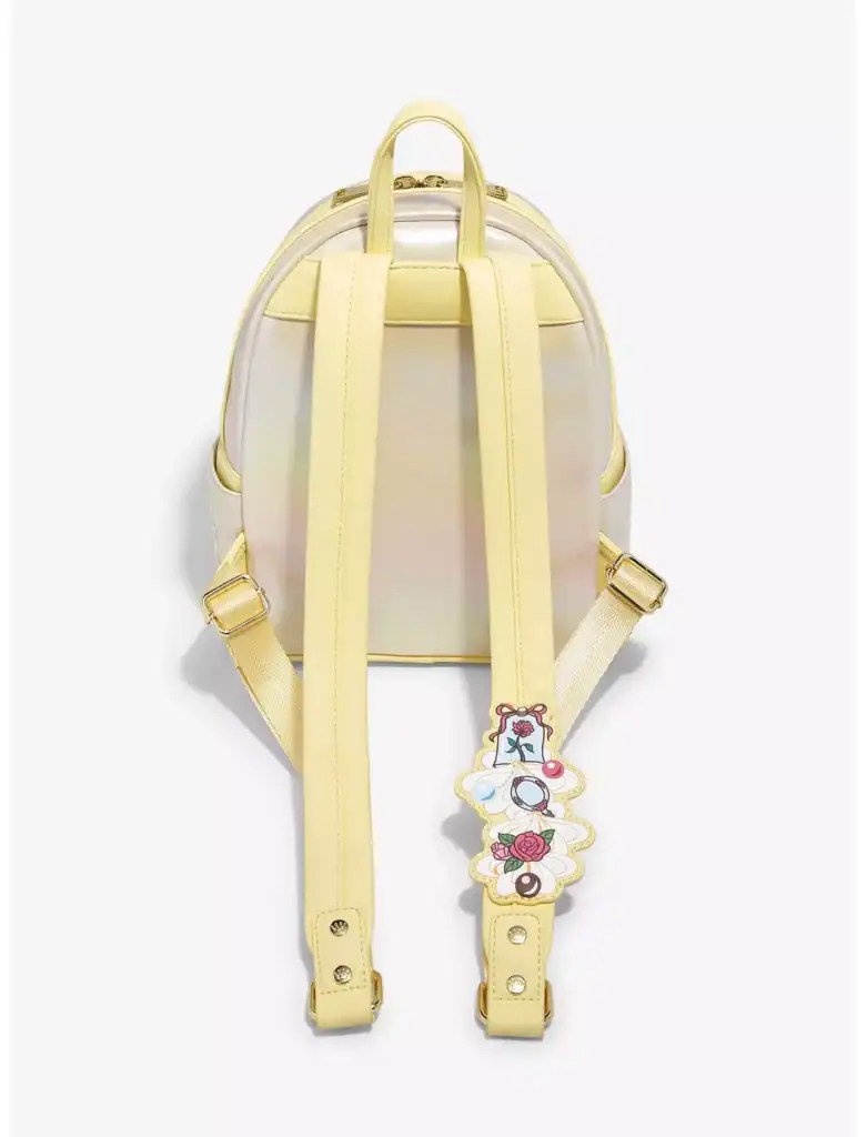 Yellow iridescent mini backpack with pastel pink accents and charm, perfect for Disney fashion lovers and Disneybounding enthusiasts.