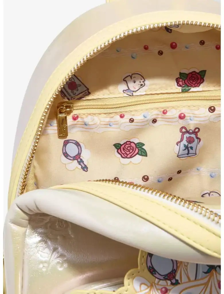 Bright yellow Disney-themed backpack with a detailed inside lining featuring Rose, mirror, and bag charms, perfect for Disney fans.