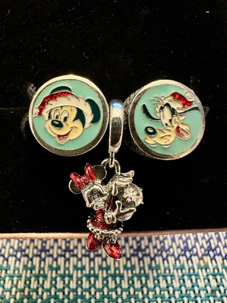 Bright Disney Minnie Mouse charm bracelet featuring festive holiday imagery and enamel details.