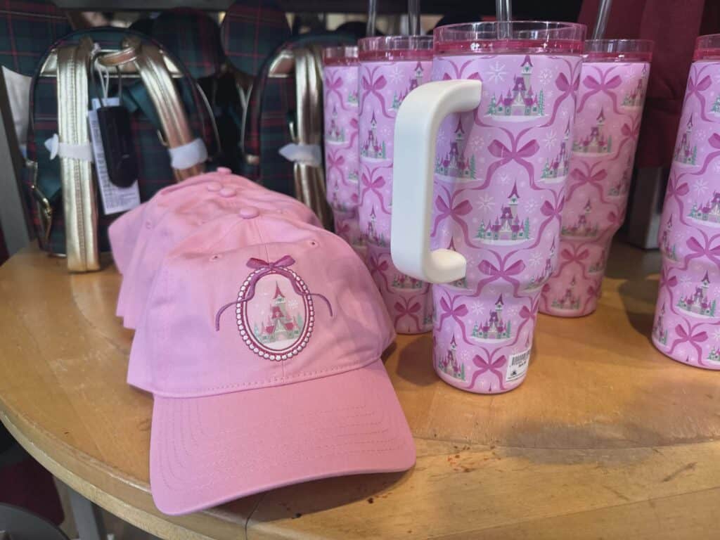 Pink Disney-themed baseball caps with Cinderella castle embroidery, perfect for Disney fans.