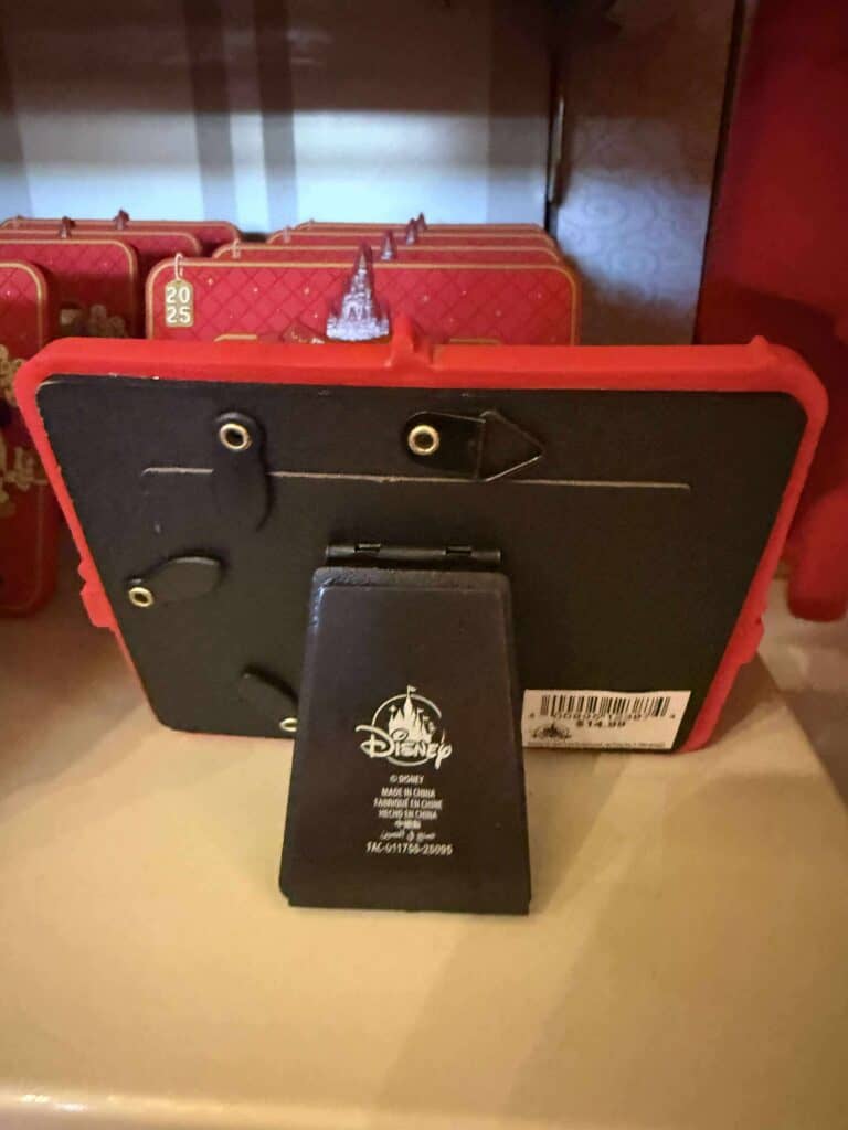 Red Disney villain handbag with safety pins and barcode.