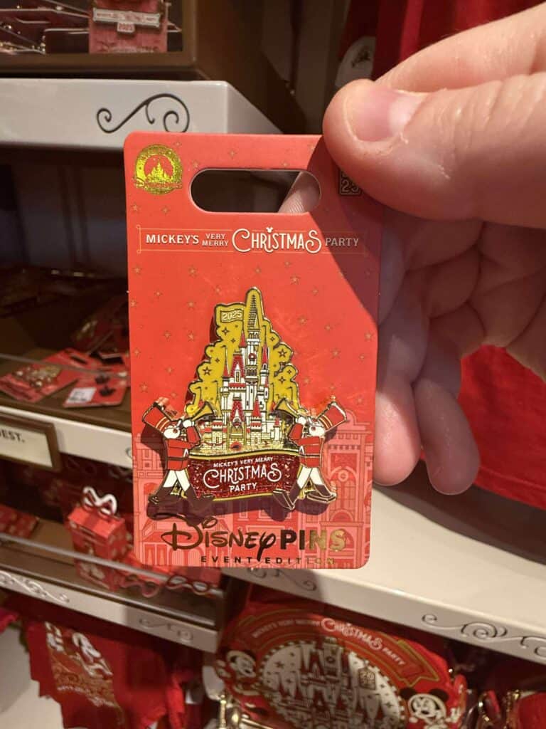 Disney Christmas pins featuring Mickey Mouse and Cinderella Castle, perfect for Disney fans and holiday collectors.
