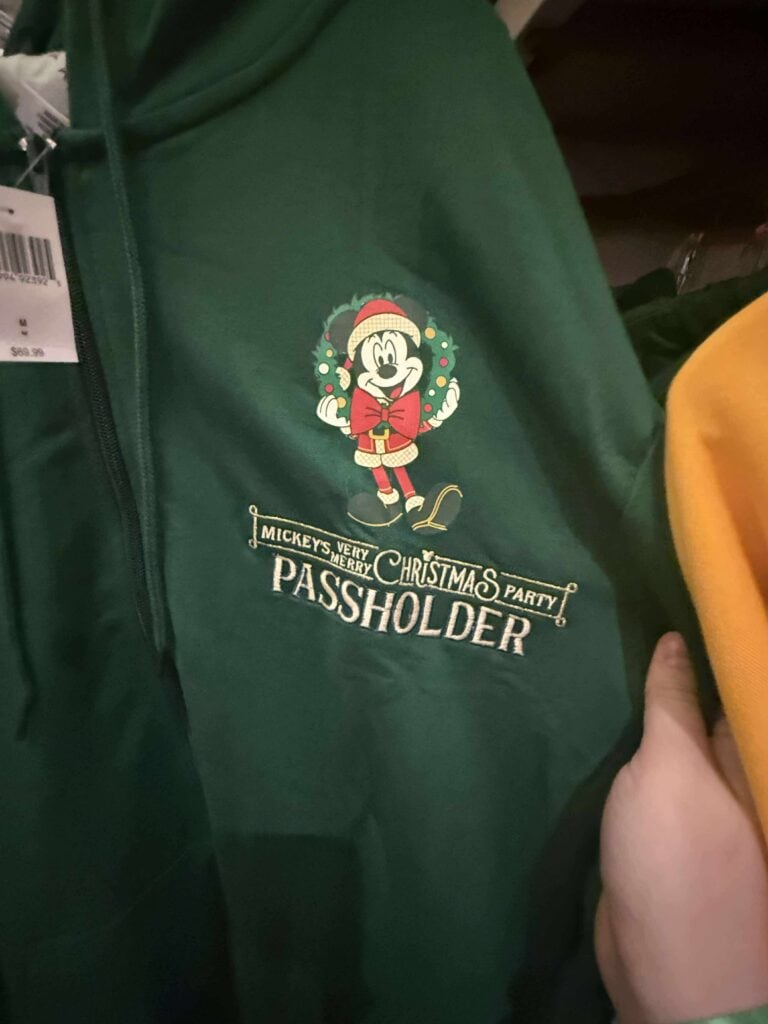 Mickey Mouse Christmas passholder hoodie, festive holiday design, Disney themed apparel for fans.