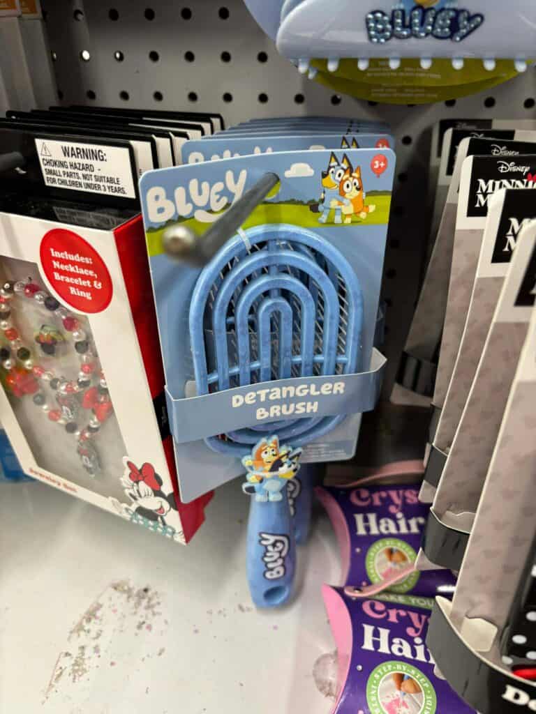 Colorful Bluey-themed hairbrush for kids' detangling fun.