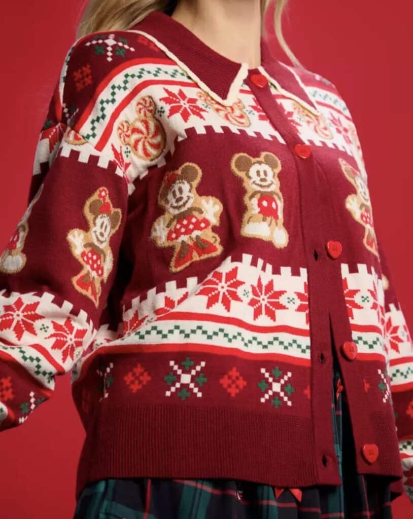 Festive Disney Christmas sweater with Mickey Mouse design and holiday patterns.