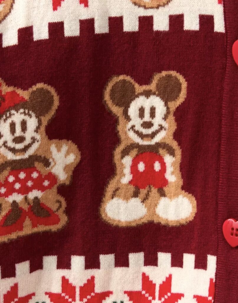 Festive Disney Mickey and Minnie Mouse Christmas sweater with holiday patterns.