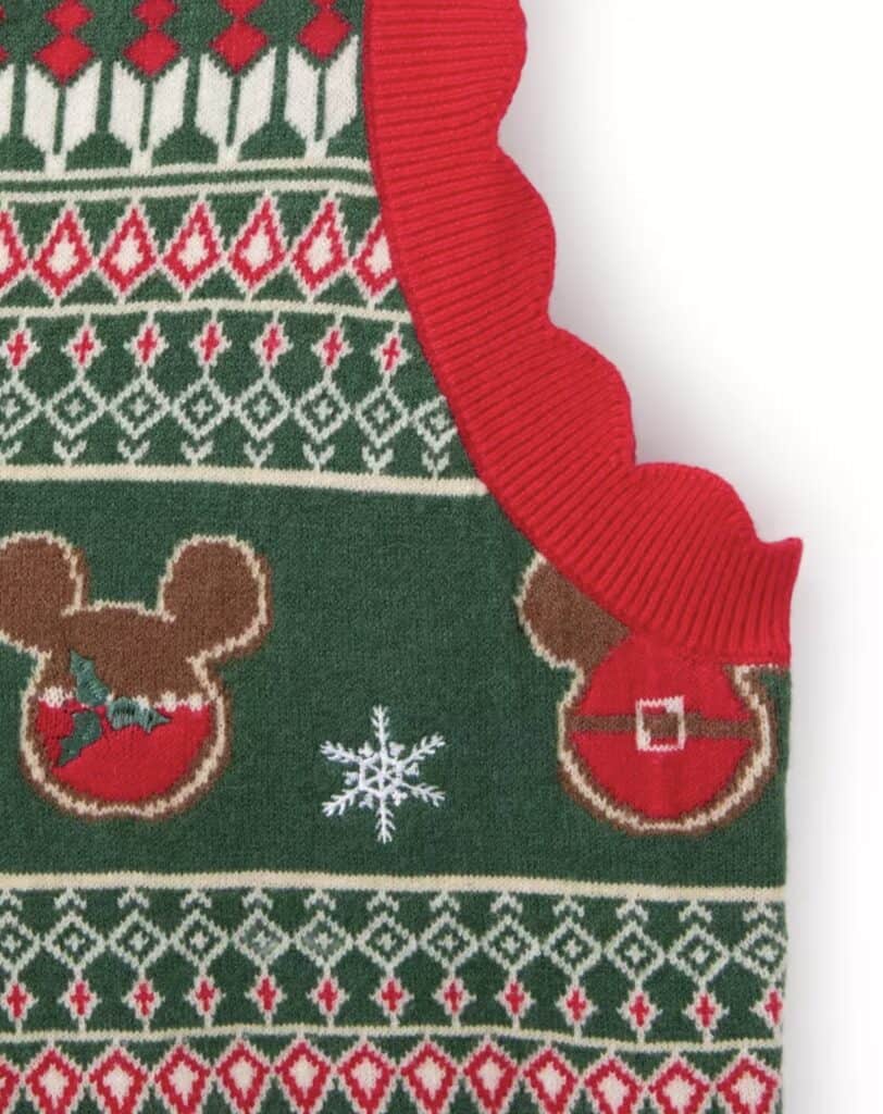 Festive Disney Christmas sweater with Mickey Mouse, snowflakes, and holiday patterns.