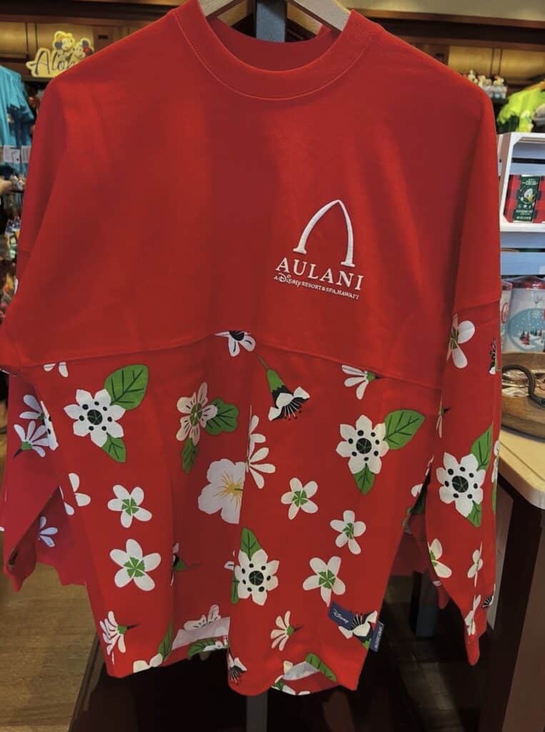 Aulani Disney Resort floral-themed holiday sweatshirt with Disney logo.