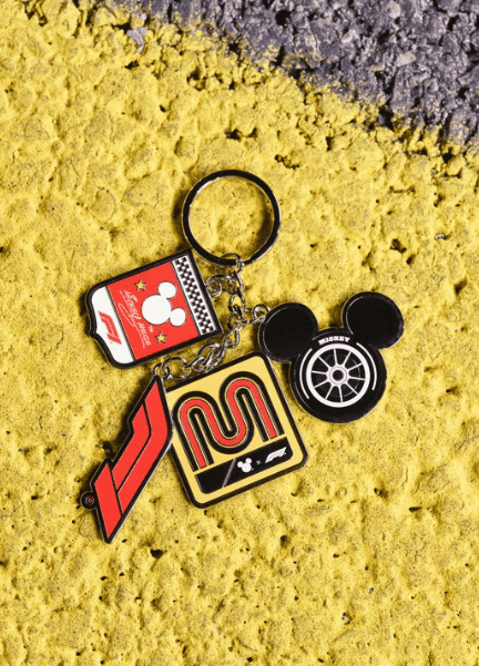 Mickey Mouse racing car keychain with Disney logo and checkered flag design.