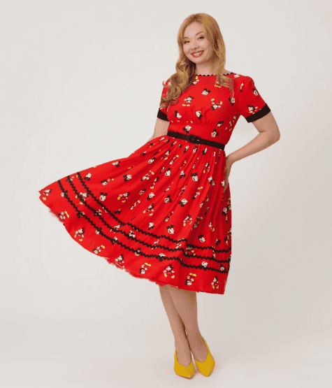 Red Disney-themed dress with floral pattern and black accents, perfect for Disney fashion lovers.