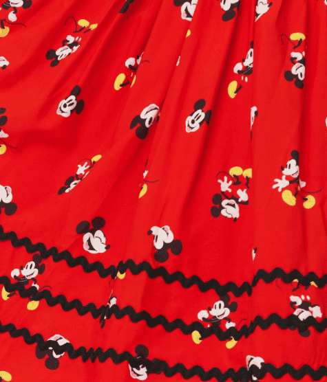 Mickey Mouse Disney fabric with red background and playful print.