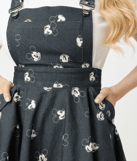Mickey Mouse themed denim pinafore dress with cute print, perfect for Disney fashion lovers.