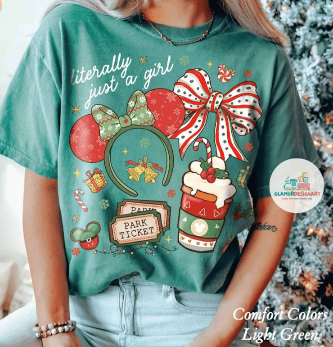 Festive Disney-themed shirt with holiday accessories and slogans, perfect for Christmas celebrations and Disney fans.