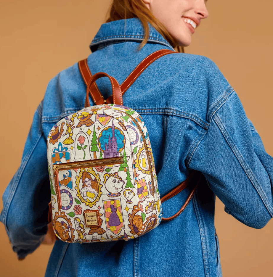 Colorful Disney princess-themed backpack with classic character illustrations.